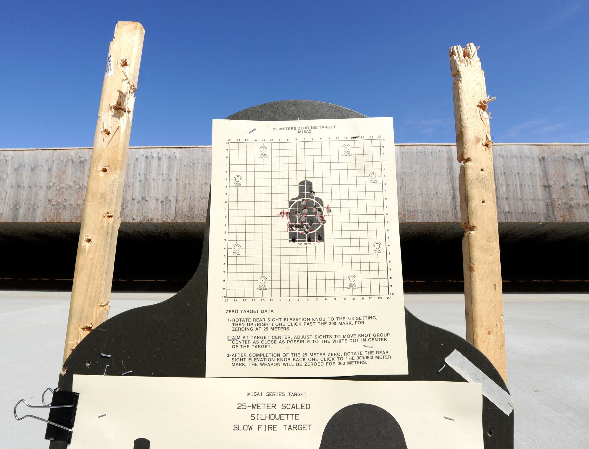 Shots made within the black target are counted as hits by the instructors at the shooting range at Fairchild Air Force Base, Wash., March 25, 2013. Shooters are required to exceed a certain amount of hits in order to pass qualification. (U.S. Air Force photo by Airman 1st Class Ryan Zeski) 
