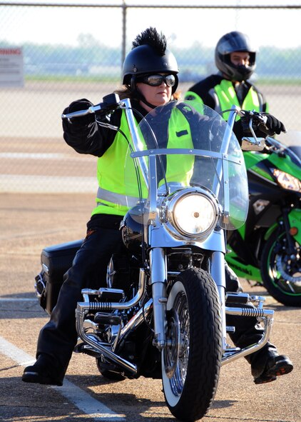 A motorcycle enthusiast prepares to participate in the Thunder on the Bayou motorcycle ride on Barksdale Air Force Base, La., April 5, 2013. The event promoted Barksdale motorcycle enthusiasts to learn about proper motorcycle safety and personal protective equipment while also encouraging mentorship and camaraderie. (U.S. Air Force photo/Airman 1st Class Benjamin Gonsier)