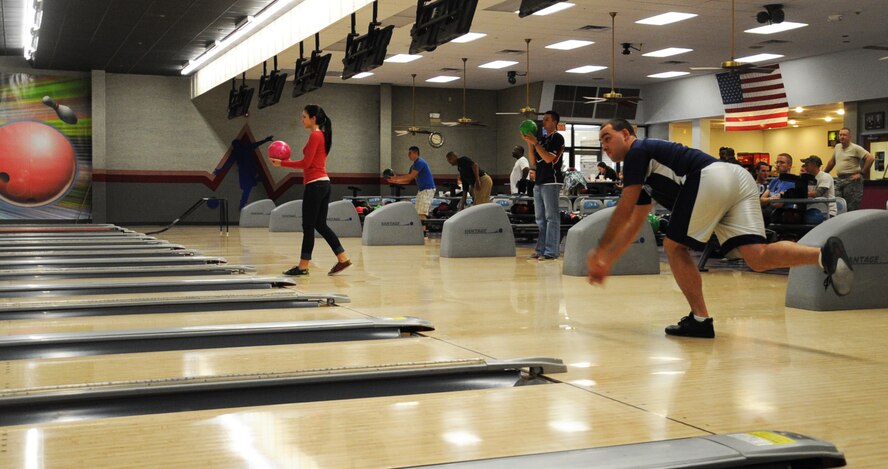 Members from Barksdale Air Force Base, La., bowl during the Strike Out!!! Sexual Assault Bowl-A-Thon here, April 5, 2013. The Bowl-A-Thon was part of Sexual Assault Awareness month, and was held to inform people about the importance of reporting sexual assault and different ways of reporting. (U.S. Air Force photo/Senior Airman Sean Martin)