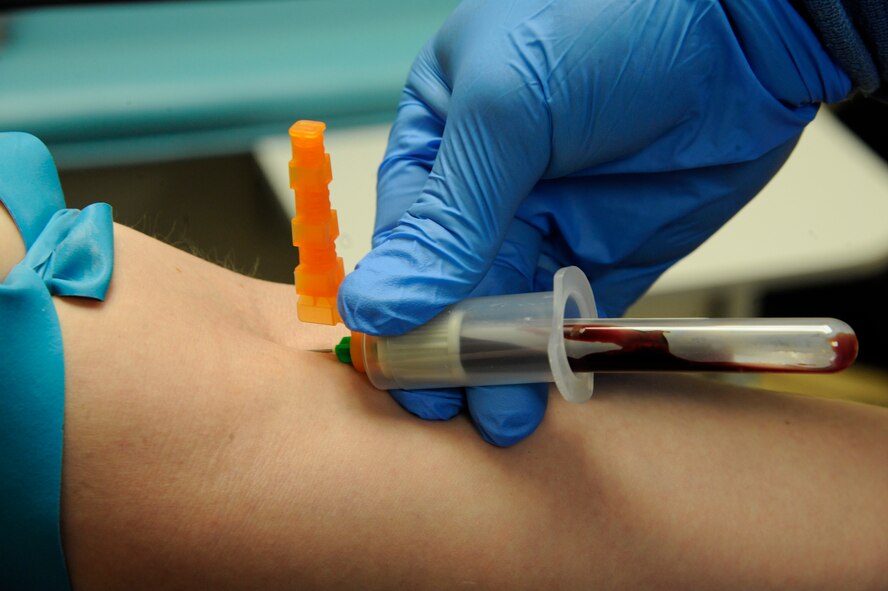 Senior Airman David Eley, 2nd Medical Support Squadron Medical Laboratory lab technician, draws blood from a patient on Barksdale Air Force Base, La., April 5, 2013. Lab technicians are responsible for throat cultures, drawing blood, and testing urine samples in order to determine the health and wellness of a patient. (U.S. Air Force photo/Airman 1st Class Andrew Moua)