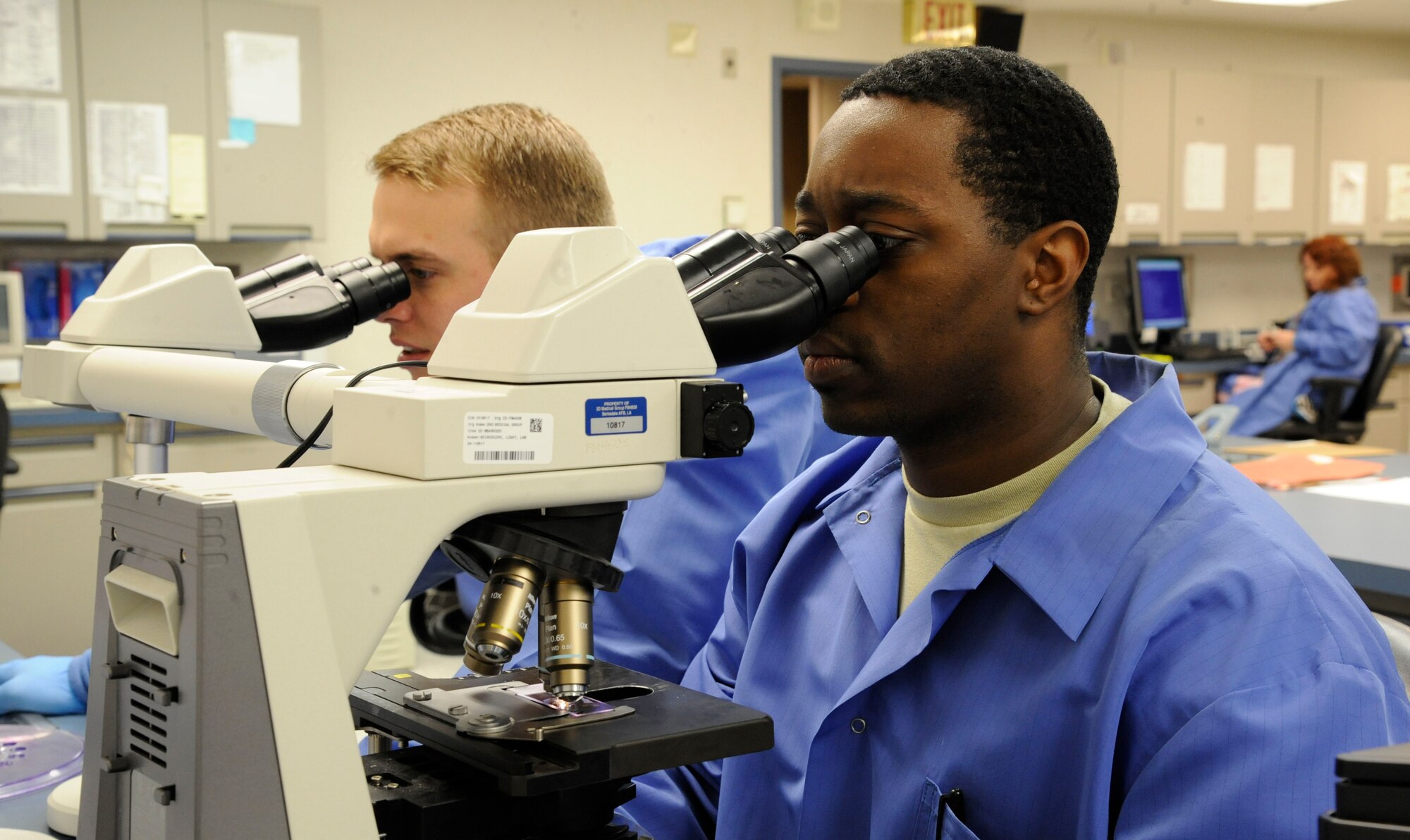 Staff Sgt. Christopher Hearst, 2nd Medical Support Squadron chemistry NCO in charge, and Senior Airman David Eley observe blood samples on Barksdale Air Force Base, La., April 5, 2013. The Airmen were conducting checks on the samples to determine if the blood had the proper amount of red and white blood cells. (U.S. Air Force photo/Airman 1st Class Andrew Moua)