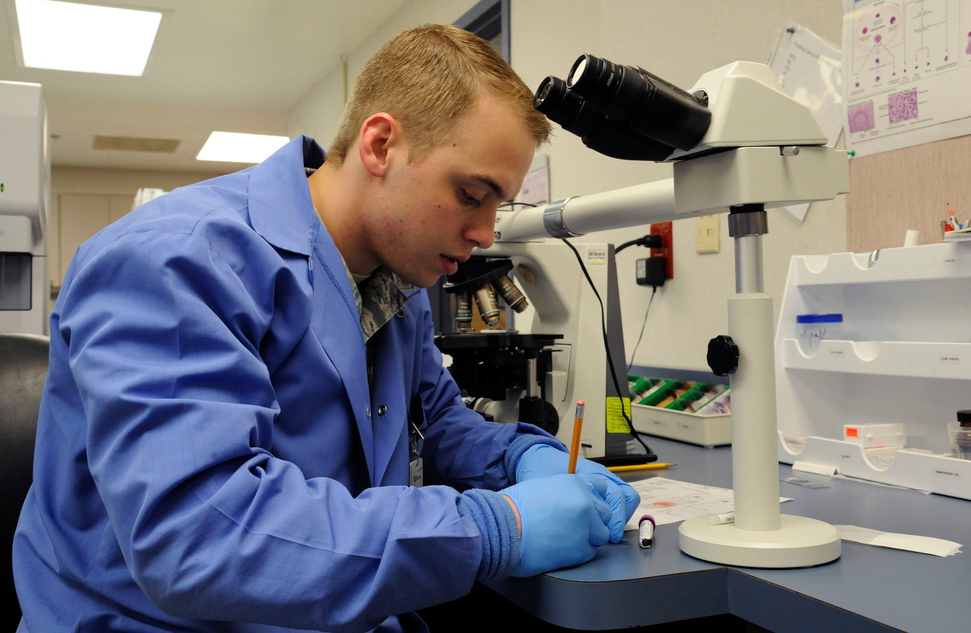 Senior Airman David Eley, 2nd Medical Group Medical Laboratory lab technician, prepares to place a sample of blood on a slide on Barksdale Air Force Base, La., April 5, 2013. Lab technicians are responsible for throat cultures, drawing blood, and testing urine samples in order to determine the health and wellness of a patient. (U.S. Air Force photo/Airman 1st Class Andrew Moua)