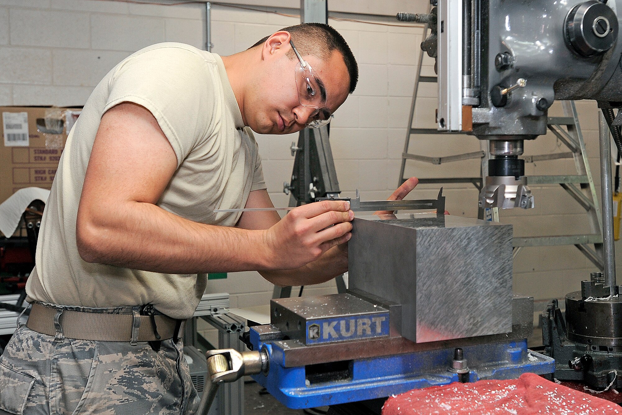 Cadet 1st Class John Patton works on a component for Falcon SAT-6 Monday, April 1st. (U.S. Air Force Photo/Sarah Chambers)