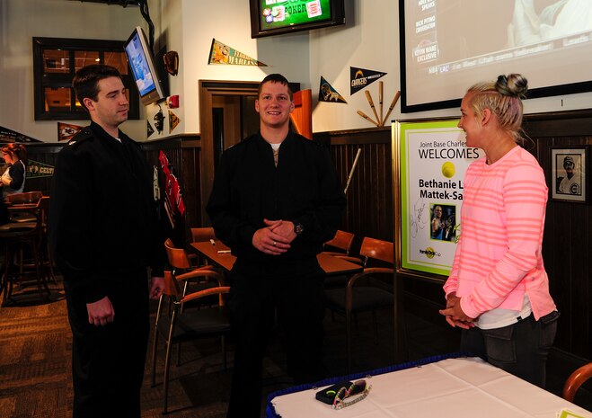 Professional tennis player Bethanie Lynn Mattek-Sands, speaks to petty officers third class Anthony Higgins and Jameson Williams, Joint Base Charleston-Weapons Station VITA Tax office electrician’s mates from Joint Base Charleston – Weapons Station, April 3, 2013, at Rookies Sports Grill at JB Charleston - Air Base, S.C. Mattek-Sands was in Charleston competing in the Family Circle Cup tennis tournament and visited the air base to sign autographs for Team Charleston members and to tour a C-17 Globemaster III. (U.S. Air Force photo by Staff Sgt. Rasheen Douglas)