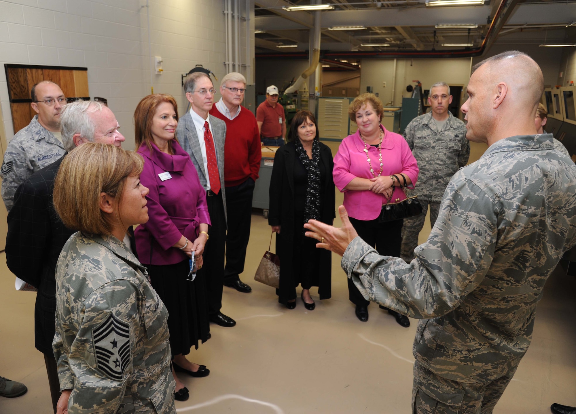 Brig. Gen. Brad Spacy, 81st Training Wing commander, right, talks about the various training equipment made at the trainer development center during an honorary commanders tour April 5, 2013, at Keesler Air Force Base, Miss.  The Keesler Honorary Commanders Program informs selected non-federal elected officials, chamber of commerce members and other civic leaders about the missions of Keesler and the Air Force and fosters positive relationships with the base’s community partners.  This visit focused on the mission of the 81st Training Group.  (U.S. Air Force photo by Kemberly Groue)