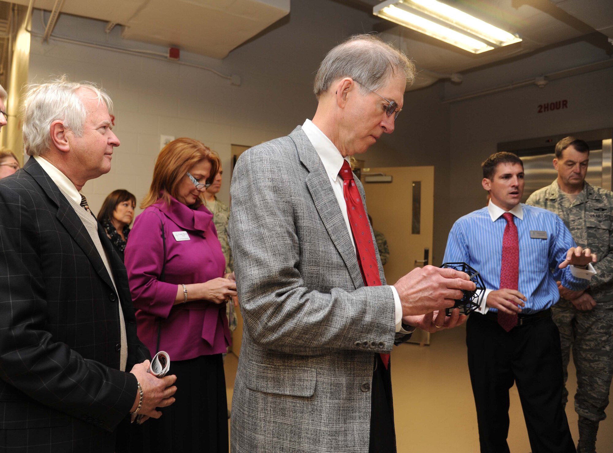 Dr. John Drake, Bienville Orthopedic Specialists, inspects a 3D training model made at the trainer development center during an honorary commanders tour April 5, 2013, at Keesler Air Force Base, Miss.  The Keesler Honorary Commanders Program informs selected non-federal elected officials, chamber of commerce members and other civic leaders about the missions of Keesler and the Air Force and fosters positive relationships with the base’s community partners.  This visit focused on the mission of the 81st Training Group.  (U.S. Air Force photo by Kemberly Groue)