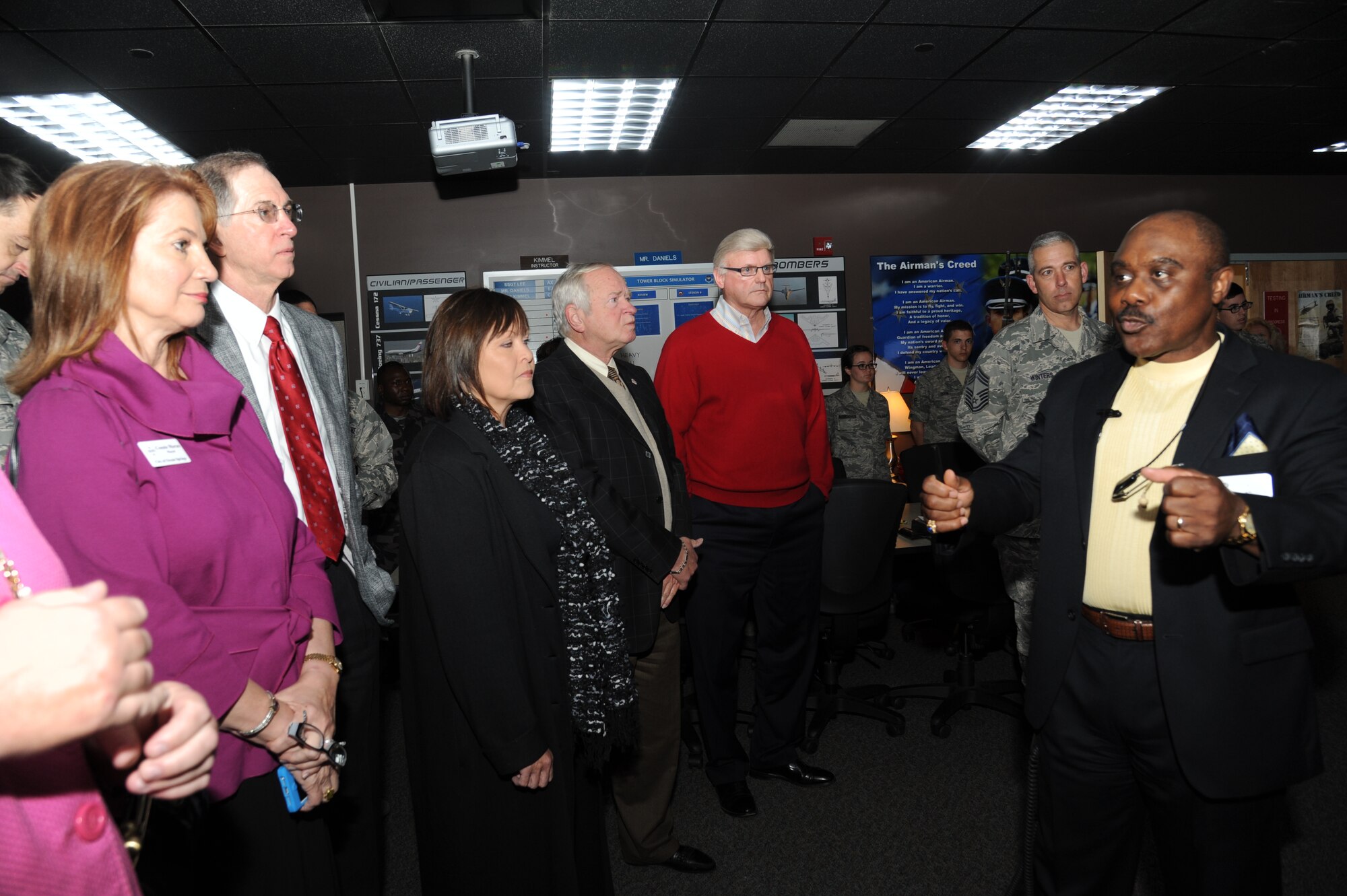 Willie Daniels, 334th Training Squadron, briefs Honorary Commanders on advancements and training in the air traffic control course during a tour April 5, 2013, at Cody Hall, Keesler Air Force Base, Miss.  The Keesler Honorary Commanders Program informs selected non-federal elected officials, chamber of commerce members and other civic leaders about the missions of Keesler and the Air Force and fosters positive relationships with the base’s community partners.  This visit focused on the mission of the 81st Training Group.  (U.S. Air Force photo by Kemberly Groue)