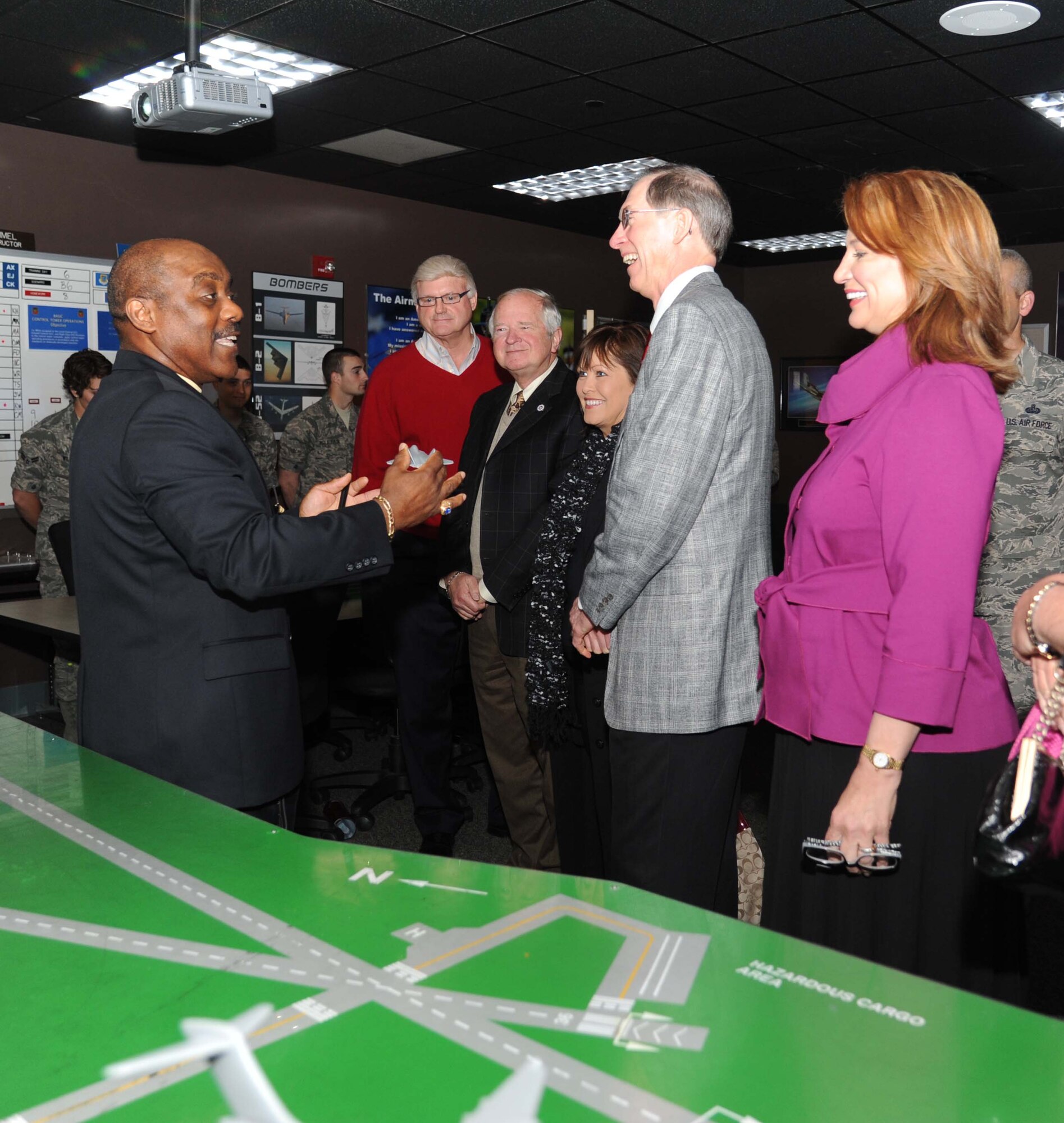 Willie Daniels, 334th Training Squadron, briefs Honorary Commanders on advancements and training in the air traffic control course during a tour April 5, 2013, at Cody Hall, Keesler Air Force Base, Miss.  The Keesler Honorary Commanders Program informs selected non-federal elected officials, chamber of commerce members and other civic leaders about the missions of Keesler and the Air Force and fosters positive relationships with the base’s community partners.  This visit focused on the mission of the 81st Training Group.  (U.S. Air Force photo by Kemberly Groue)