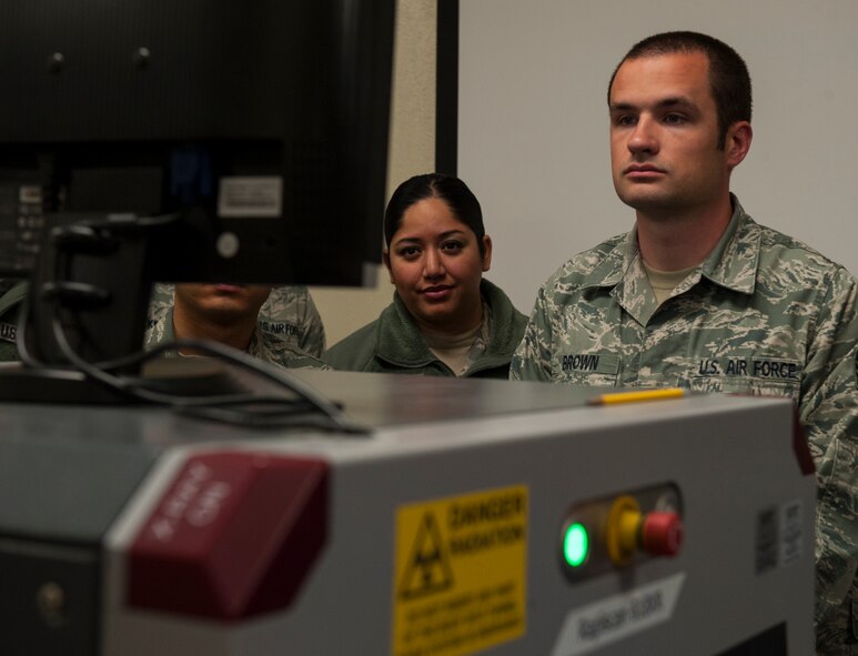 Staff Sgt. Charles Brown, 7th Logistics Readiness Squadron, learns how to properly use an X-ray machine during training March 27, 2013, at Dyess Air Force Base, Texas. The Transportation Security Administration, or TSA, trained 7th LRS Airmen on how to properly process passengers, cargo and how to identify if a threat is present. (U.S. Air Force photo by Airman 1st Class Jonathan Stefanko/ Released)