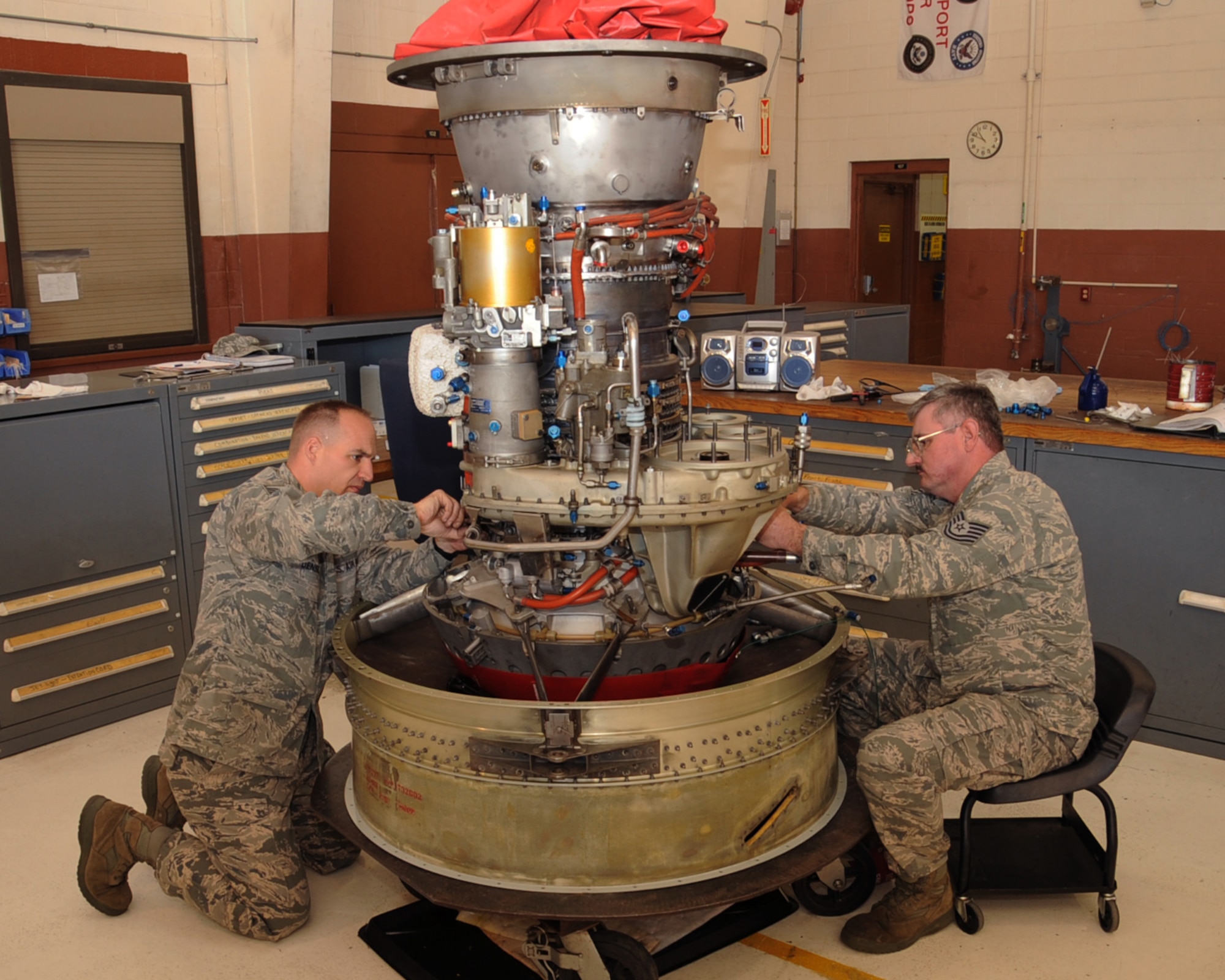 Master Sgt. Joseph Densmore and Tech. Sgt. Richard Murchison, 917th Maintenance Squadron jet engine mechanics, work on an A-10 Thunderbolt II engine on Barksdale Air Force Base, La., April 5, 2013. The 917 MXS is responsible for more than 100 A-10 engines. (U.S. Air Force photo/Senior Airman Sean Martin)
