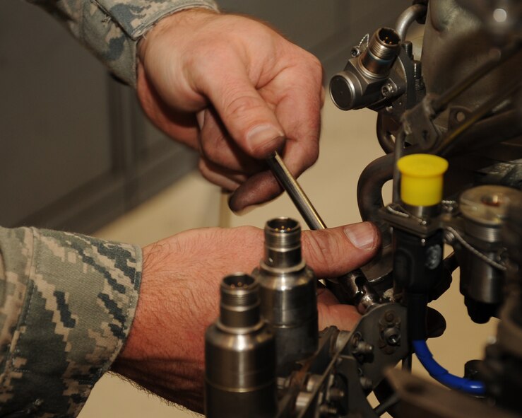 Master Sgt. Joseph Densmore, 917th Maintenance Squadron jet engine mechanic, tightens a screw on an A-10 Thunderbolt II on Barksdale Air Force Base, La., April 5, 2013. The 917 MXS has two test cells which are used to perform operational checks on A-10 engines. (U.S. Air Force photo/Senior Airman Sean Martin)