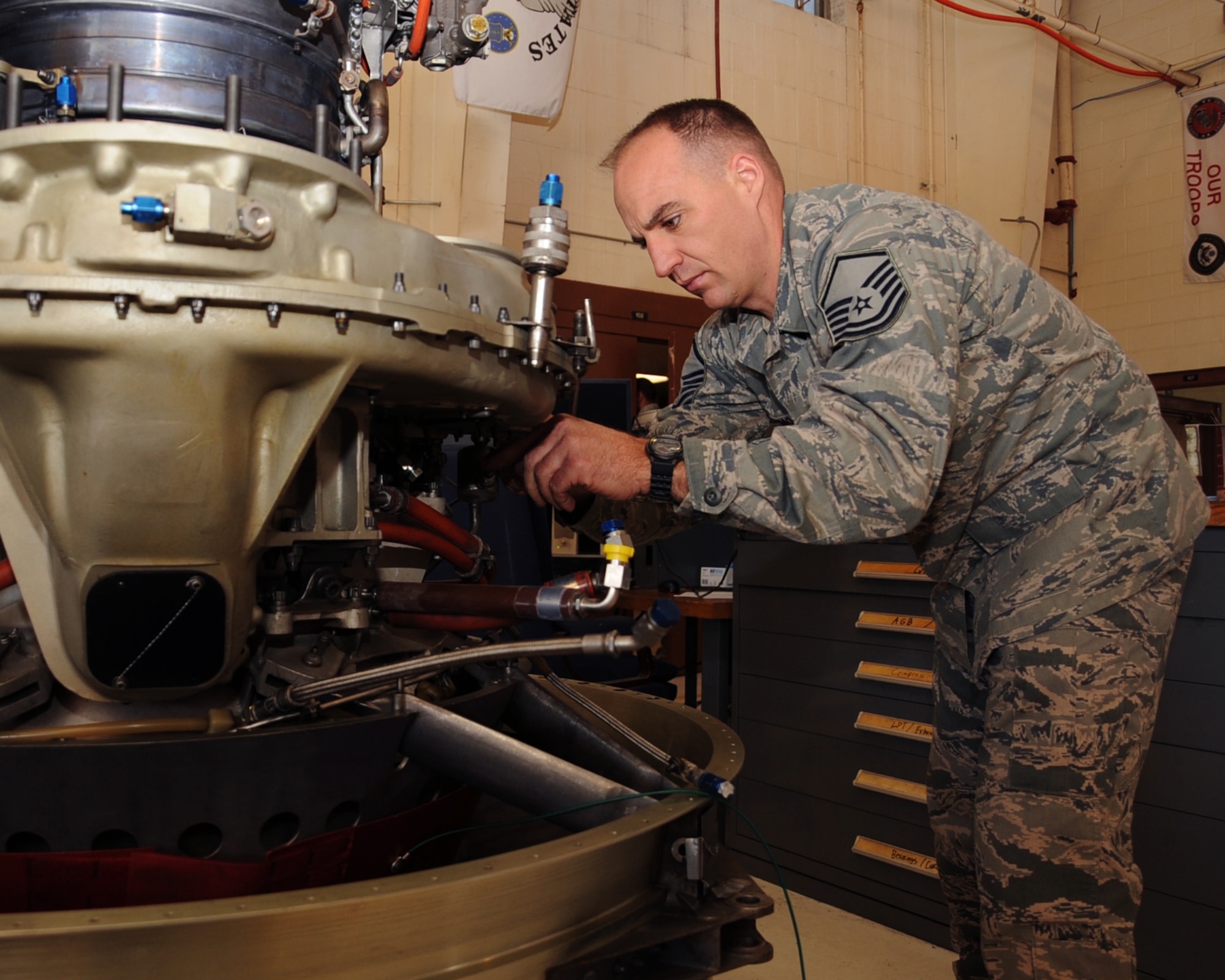 Master Sgt. Joseph Densmore, 917th Maintenance Squadron jet engine mechanic, repairs a part on an A-10 Thunderbolt II engine. The 917 MXS engine shop has seven service bays and is the only engine shop for the Air Force Reserve Command for all TF-34 engines. (U.S. Air Force photo/Senior Airman Sean Martin)