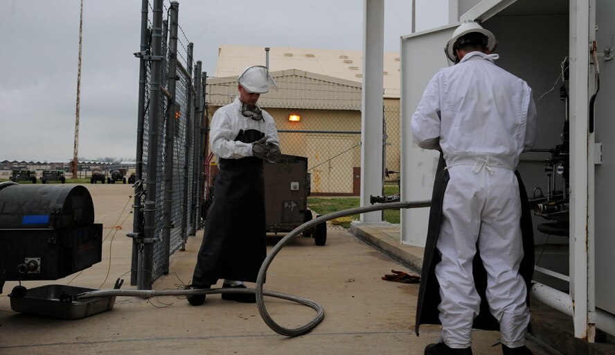 Staff Sgt. Mitchell Newman and Senior Airman Daniel Bohn, 2nd Logistics Readiness Squadron Fuels Facilities, prepare to fill a lox cart with liquid oxygen on Barksdale Air Force Base, La., April 4, 2013. The fuels facilities section is in charge of the reception, storage and distribution on fuel for Barksdale's fleet of B-52H Stratofortress bombers. (U.S. Air Force photo/Airman 1st Class Andrew Moua)