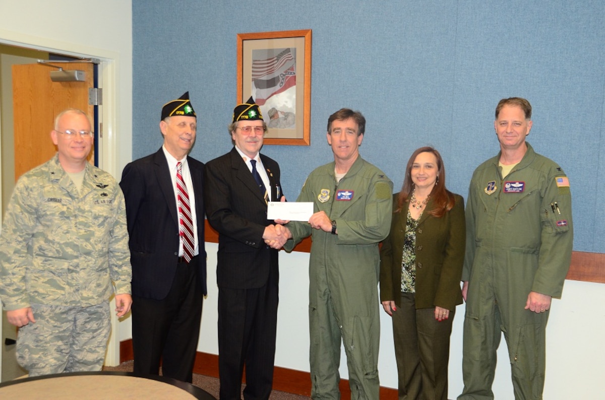 Steve Guyton (2nd from left), Boys State Program Director and Joe Kersh (3rd from left) Adjutant of The American Legion Mississippi Delta Post No. 1776, made a generous monetary donation while at the 172d AW Wednesday, April 4 2013. Accepting the donation that will benefit the children of MSNG members was Brig Gen William J. Crisler (far left), MSANG Chief of Staff, Col Jonathan T. Wall (3rd from right), Commander of the 172d AW, Marianne Breland (2nd from right), 172d AW’s Airman and Family Readiness Program Manager and Col James Hartline (far right),