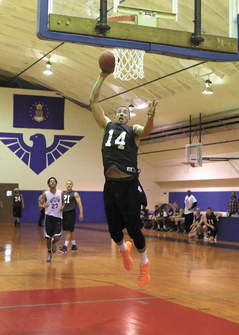 Ronald Rhea, 264th Medical Battalion, goes up for a dunk.(Photo by Robbin Cresswell)