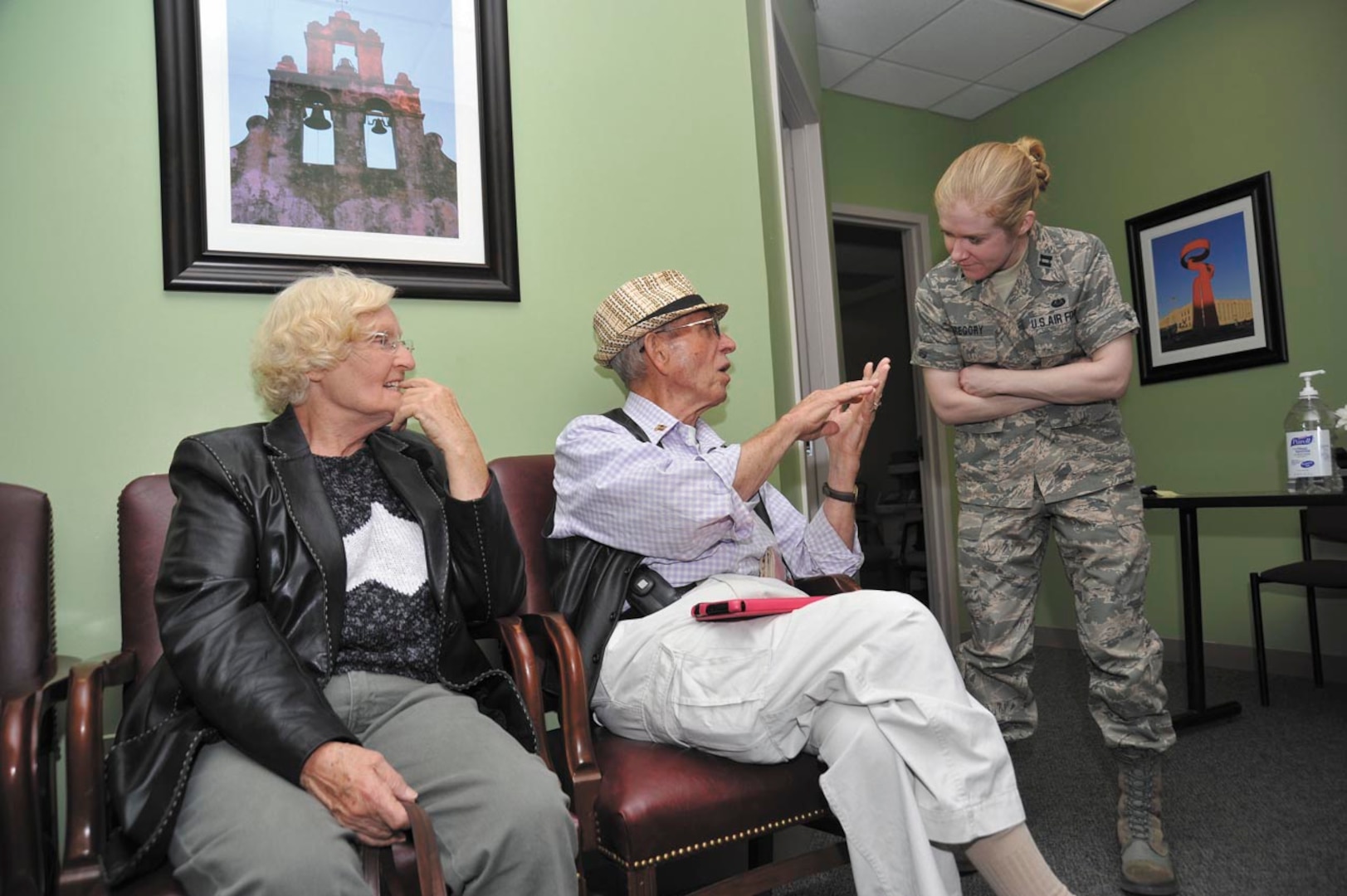 Elisabeth and Terry Clark (left) speak with Capt. Valerie Gregory prior to their appointment at the JBSA-Lackland Tax Center. Gregory coordinates the daily operations at the Tax Center and is also a volunteer preparer. (Photo by Alan Boedeker)