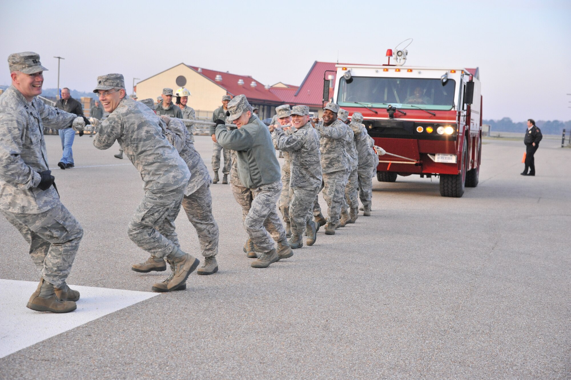 Maxwell Airmen pull a fire truck as part of the 2013 Air Force Assistance Fund kickoff rally March 29. The event also featured a formation run and a tug of war competition. (U.S. Air Force photo by Staff Sgt. Sandra Percival)