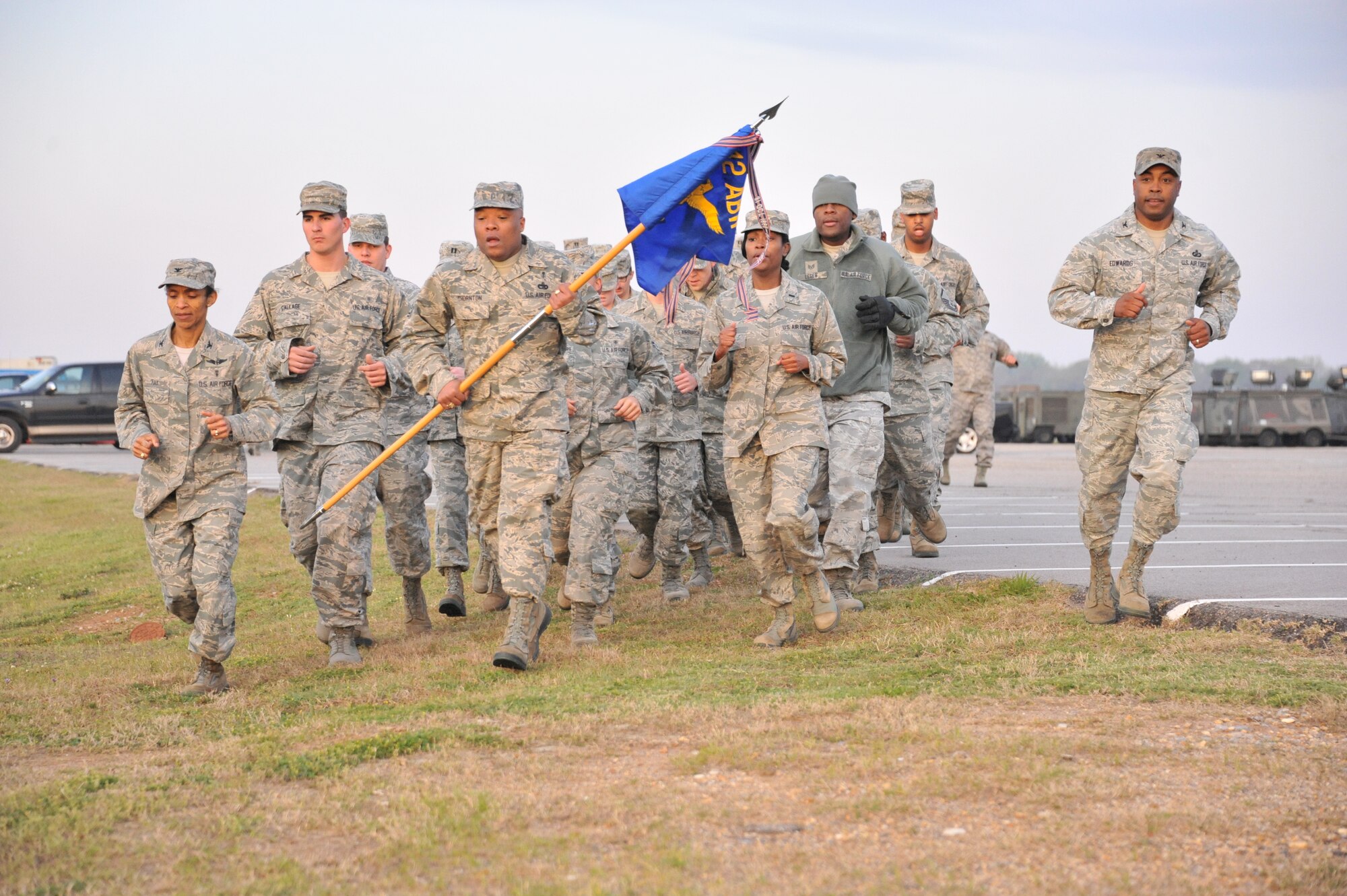 Colonel Trent Edwards, 42nd Air Base Wing commander, right, leads members of the wing in a formation run as part of the 2013 Air Force Assistance Fund kickoff rally March 29. (U.S. Air Force photo by Staff Sgt. Sandra Percival)