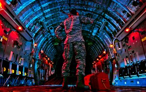 Senior Airman Joseph Farrell checks the inside of the C-17 Globemaster III before beginning a preflight inspection March 27, 2013, at Wright-Patterson Air Force Base, Ohio. Farrell is an electronic warfare systems journeyman assigned to the 445th Aircraft Maintenance Squadron. The C-17 can take off and land on runways as short as 3,500 feet and 90 feet wide. (U.S. Air Force/photo Staff Sgt. Mikhail Berlin)
