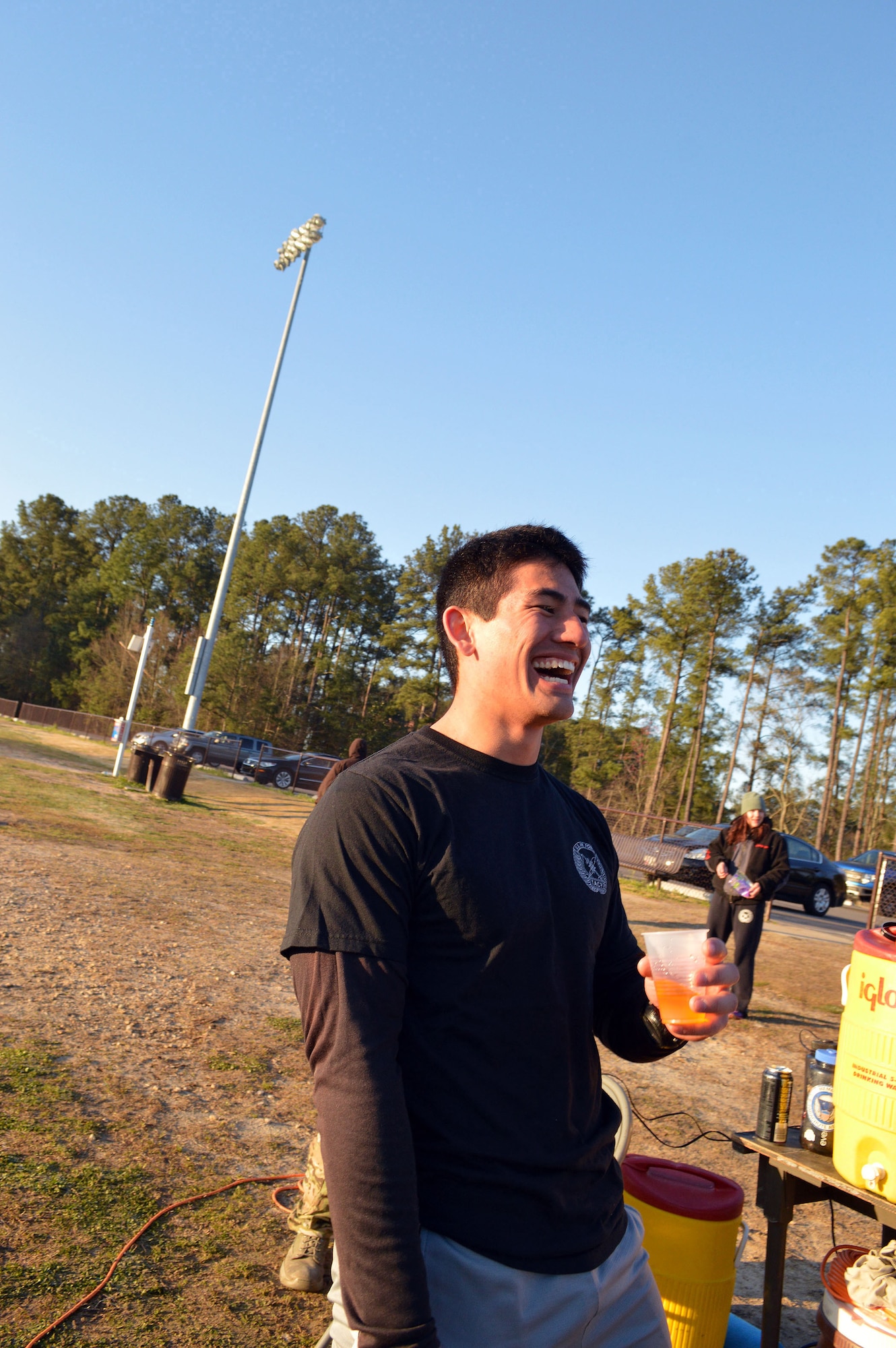 Airman 1st Class Nicholas Bertsch, a Tactical Air Control Party Airman, assigned to the 14th Air Support Operations Squadron, talks with fellow TACP Airmen at the Hedrick Stadium track during the second annual worldwide TACP 24-hour Run Challenge fundraising event.  The event is held to honor and raise funds for fallen TACP brothers in arms and their families.  (U.S. Air Force photo by Marvin Krause/Released)