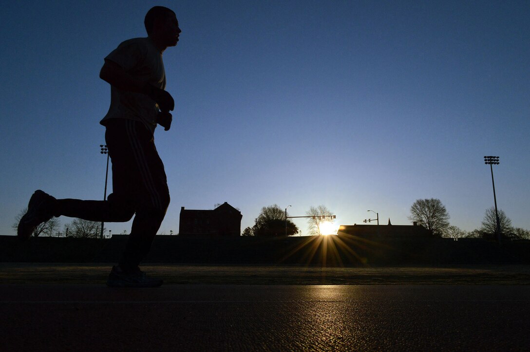 Senior Airman Kasie Carrell, a Tactical Air Control Party Airman assigned to the 14th Air Support Operations Squadron, Pope Army Airfield, runs laps at Hedrick Stadium track, Ft Bragg, N.C., during the TACP Association's second annual worldwide TACP 24-hour Challenge Run, March 28-29.  The event is held to honor fallen TACP brothers in arms and their families.  (U.S. Air Force photo by Marvin Krause/Released)