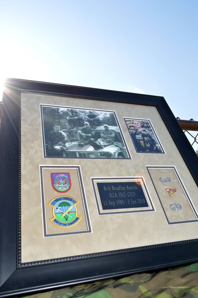 A memorial to Senior Airman Bradley Smith is displayed at the Hedrick Stadium track during the Tactical Air Control Party annual 24-hour Challenge Run, March 28-29. Airman Smith, along with three other service members, were killed during a complex ambush after a roadside bomb detonated near a platoon he was serving with Jan 3, 2010. The 26 year-old Airman volunteered to accompany the platoon medic to help treat and retrieve the wounded service members. A second bomb detonated, claiming his life. Tactical Air Control Party Airmen assigned to Pope Army Airfield, Fort Bragg, N.C., units participated in the second annual worldwide TACP 24-hour Run Challenge fundraising event, held to honor fallen TACP brothers in arms and their families. (U.S. Air Force photo/Marvin Krause) 

