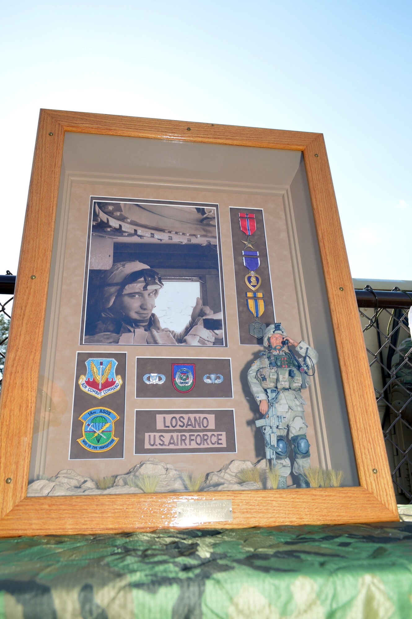 A memorial to Airman 1st Class Raymond Lasano is displayed at the Hedrick Stadium track during the Tactical Air Control Party annual 24-hour Challenge Run, March 28-29.  Airman Losano was from the 14th Air Support Operations Squadron and deployed to Afghanistan with the 82nd Airborne in March 2003.  Airman Losano’s unit was ambushed April 25, 2003 and was one of two service members mortally wounded in the attack.  Before Airman Losano took his last breath, he called in the air strike that saved the rest of his company.  Tactical Air Control Party Airmen assigned to Pope Army Airfield, Fort Bragg, N.C., units participated in the second annual worldwide TACP 24-hour Run Challenge fundraising event, held to honor fallen TACP brothers in arms and their families.  (U.S. Air Force photo by Marvin Krause/Released)