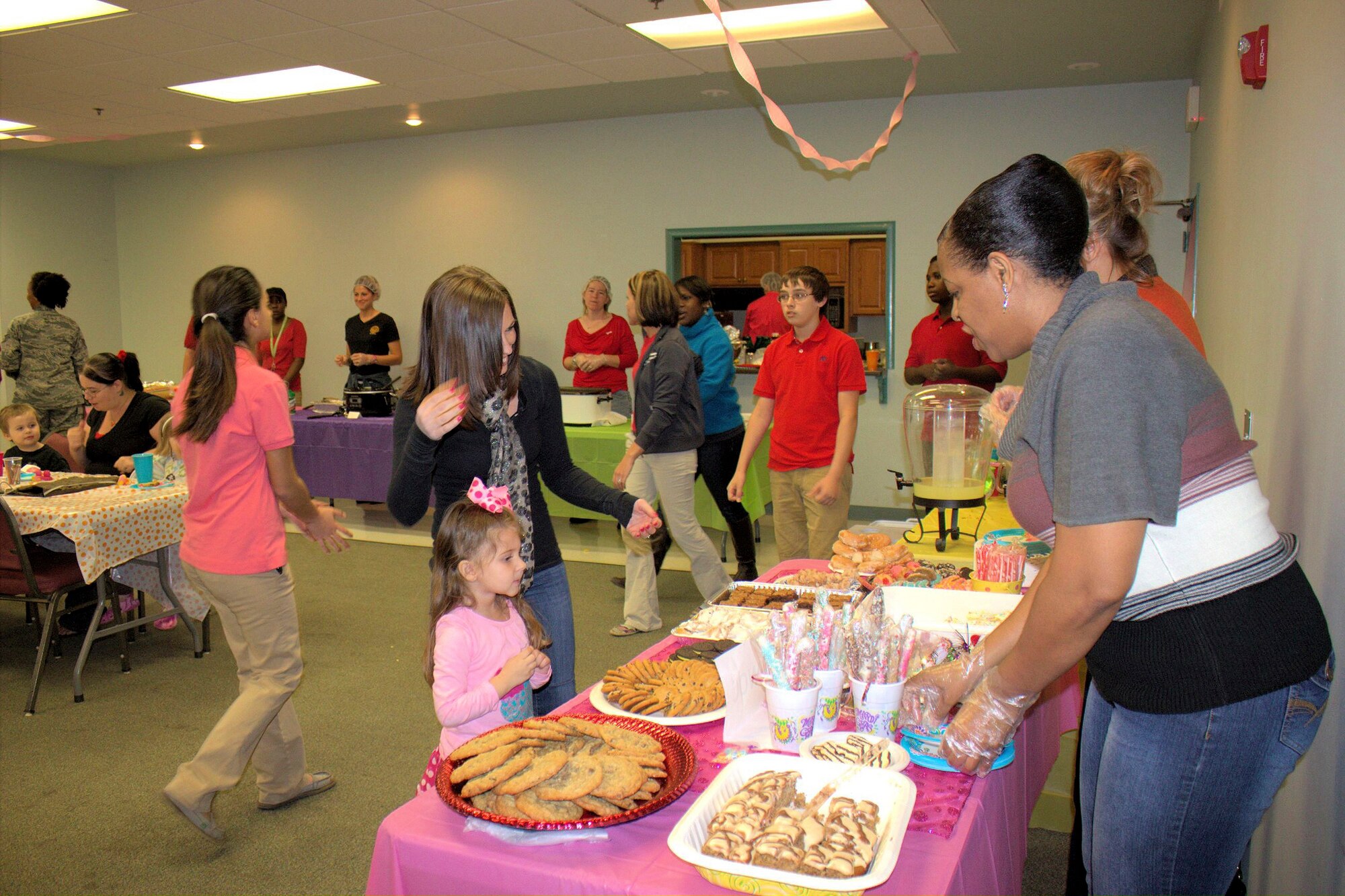 Volunteers serve food during a Deployed Spouses Dinner March 26, 2013, at Moody Air Force Base, Ga. Forty-seven adults and 55 children took part in the dinner, which was hosted by the Liberty Moody Keystone Club. (Courtesy photo) 