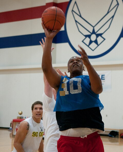 Tech. Sgt. Lyron Paul of the 90th Force Support Squadron intramural basketball team takes a shot during the final game of the F. E. Warren intramural basketball tournament in the Freedom Hall Fitness Center April 1. (U.S. Air Force photo by R.J. Oriez)