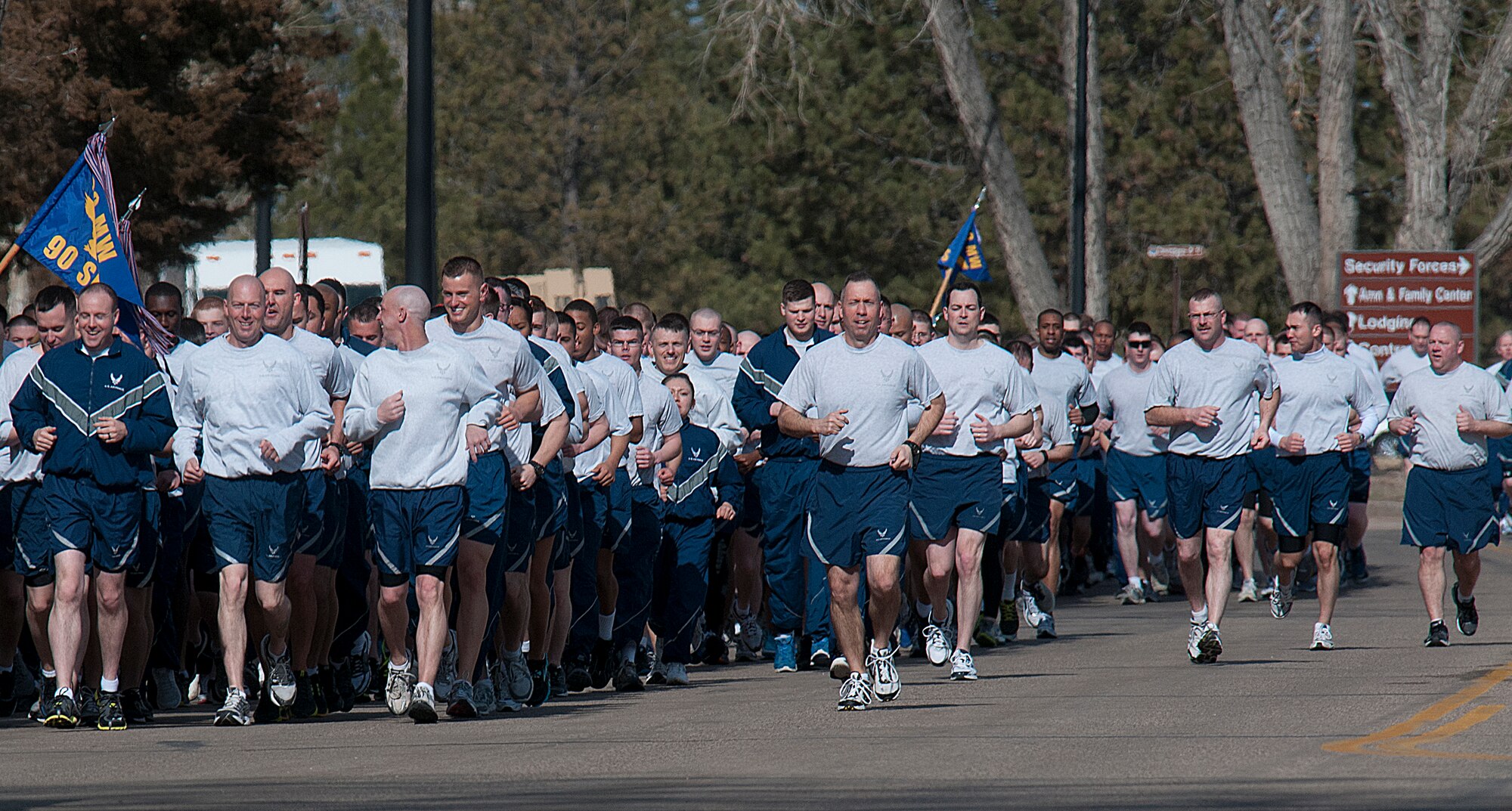 Col. Tom Wilcox, 90th Security Forces Group commander, center, joins 350 Airmen on a two-mile “pride run” March 29. According to Chief Master Sgt. Shawn Drinkard, 90th SFG chief enlisted manager, the four squadrons that make up the group, held the run to demonstrate the unit’s discipline and precision. (U.S. Air Force photo by R.J. Oriez)