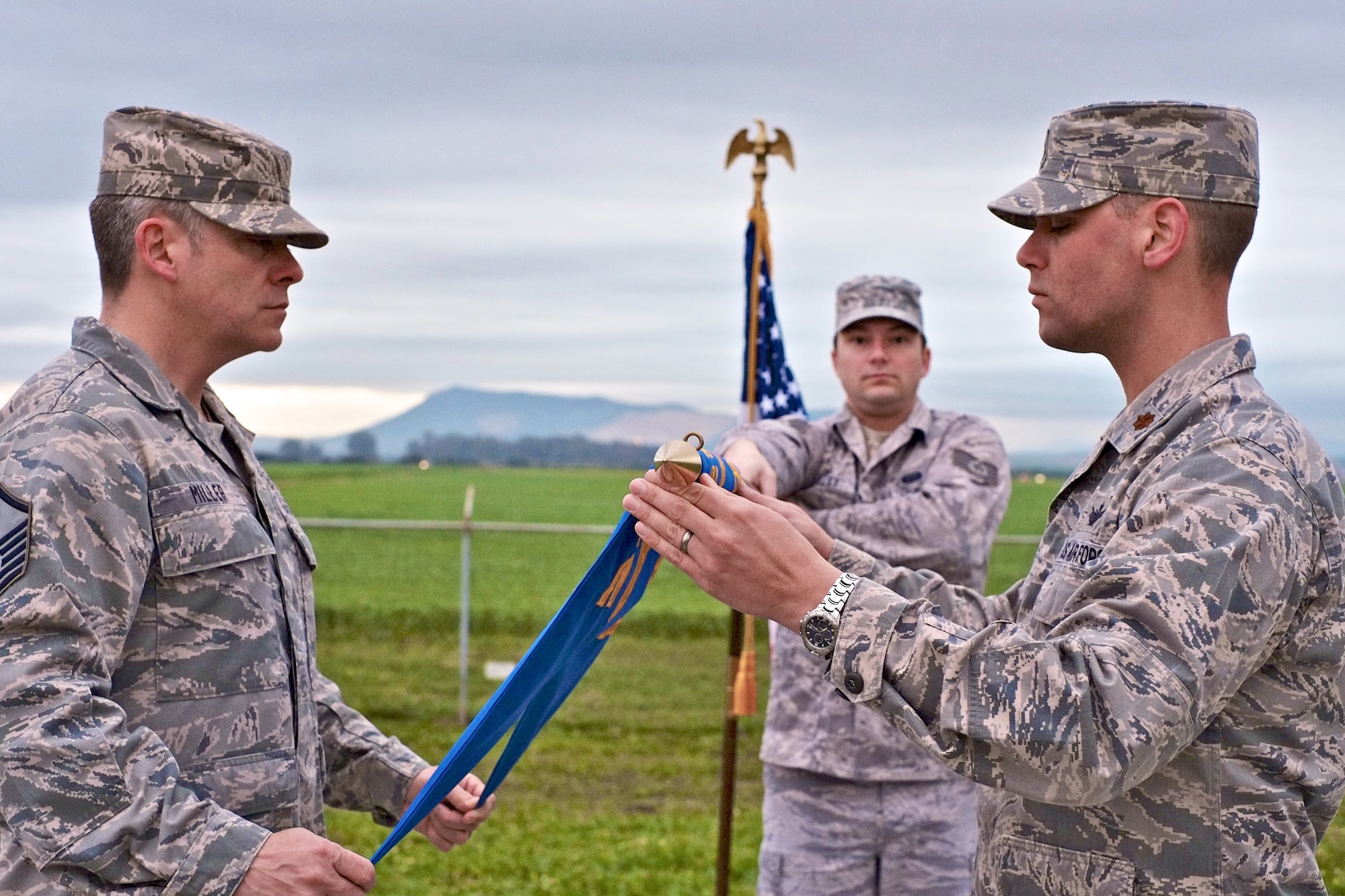 The Morón Optical Space Surveillance System, known as Detachment 4, 21st Operations Group, in Morón, Spain, closed March 31. Data from the telescope, which had become increasingly more costly to operate, was replaced by new space surveillance systems that have come online in recent years. The detachment held a small guidon casing ceremony March 20. Participating in the ceremony were (left to right) Master Sgt. Phillip Miller, Staff Sgt. Wayne Bartlett, and Maj. Jacob Pairsh, the last Det. 4 commander. (U.S. Air Force photo/Douglas Cleary II)