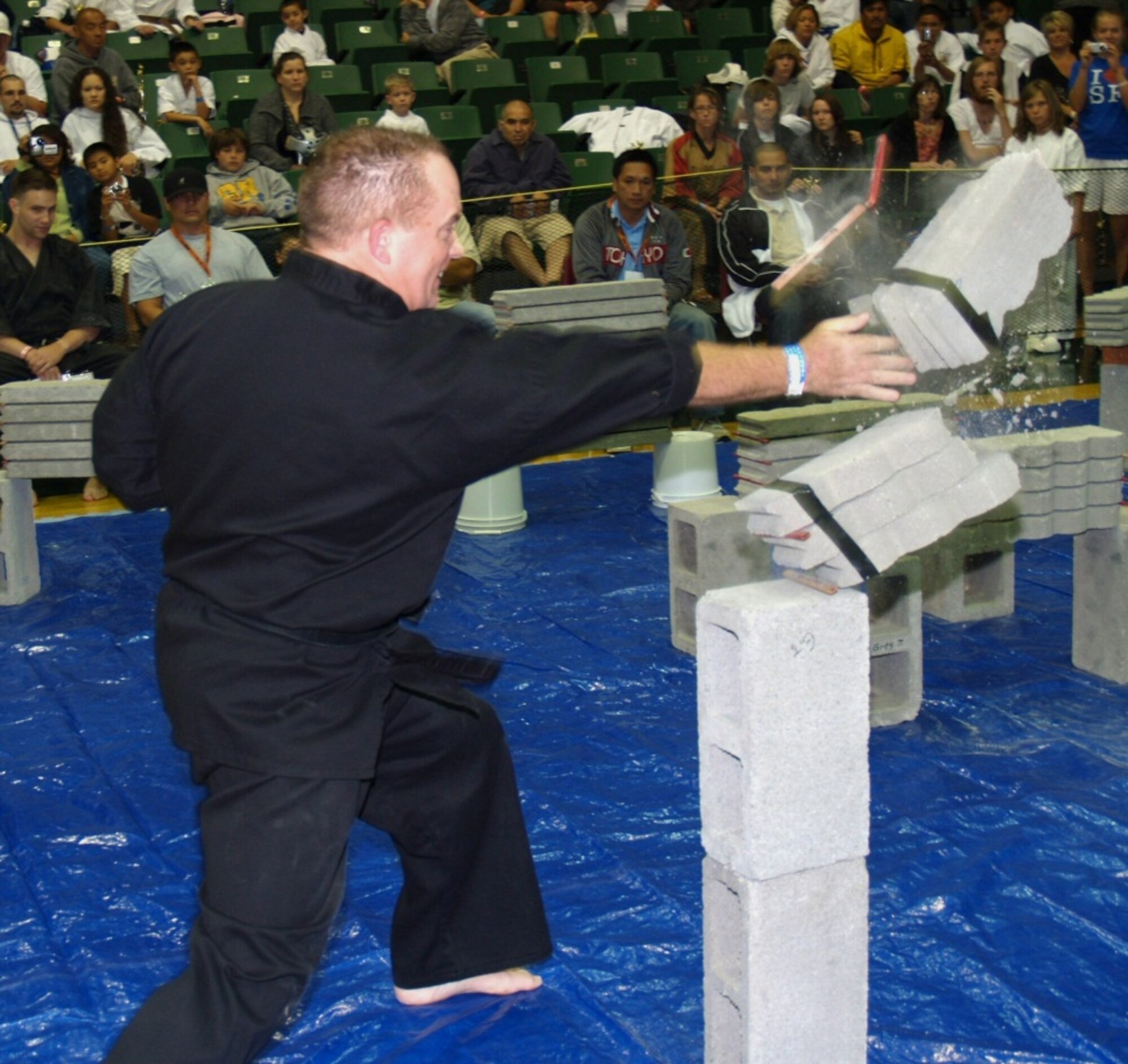 Gregory Trumbull, 60th Medical Group patient moving items center managerm breaks bricks during his appearance at the 2008 San Francisco Nationals. Trumball won the event. (Courtesy photo)