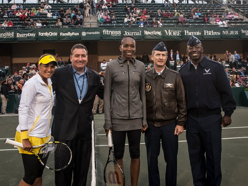 Col. James Fontanella, 315th Airlift Wing commander (second from right), and Col. Dennis Dabney, 437th Maintenance Group commander, pose with (left to right) Monica Puig, Prudential Manager Monty Shealy, and Venus Williams after the coin toss to open a match April 3, 2013, at the Family Circle Cup Tennis Tournament in Daniel Island, S.C. (U.S. Air Force photo/ Senior Airman Dennis Sloan)