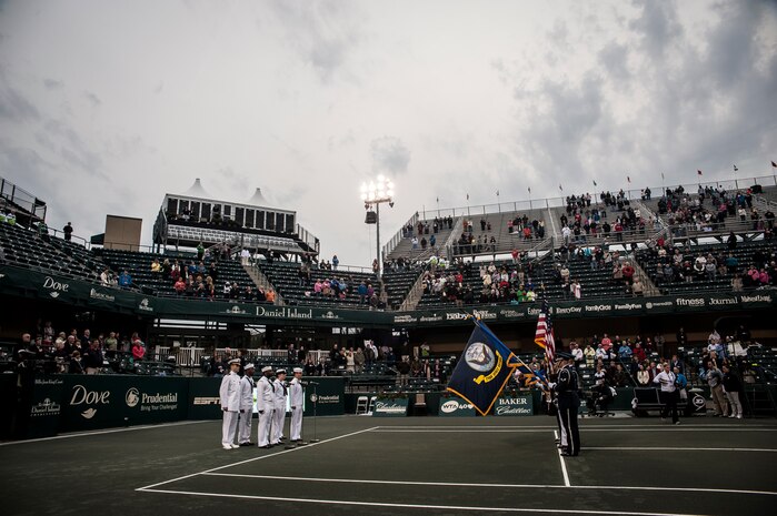 Joint Base Honor Guard members post the Colors April 3, 2013, at the Family Circle Cup Tennis Tournament in Daniel Island, S.C. A five-member honor guard team posted the Colors and base leaders had the honor of conducting the coin toss prior to the match. (U.S. Air Force photo/ Senior Airman Dennis Sloan)