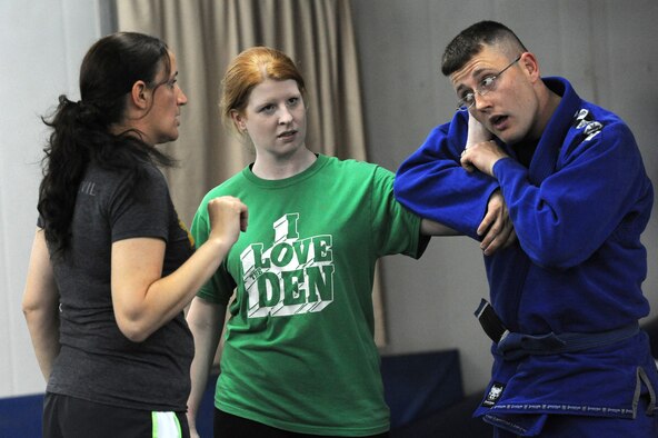 Staff Sgt. Anthony Gray, 386th Air Expeditionary Wing, Chaplains Assistant, teaches participants how to defend themselves against having their hair pulled by an attacker during the Sexual Assault Awareness Month, Brazilian Jiu-Jitsu class at the 386th Air Expeditionary Wing, Southwest Asia Apr 3, 2013. The self-defense classes are one of the many events scheduled throughout the month to raise awareness. (U.S. Air Force photo by Senior Master Sgt. George Thompson)