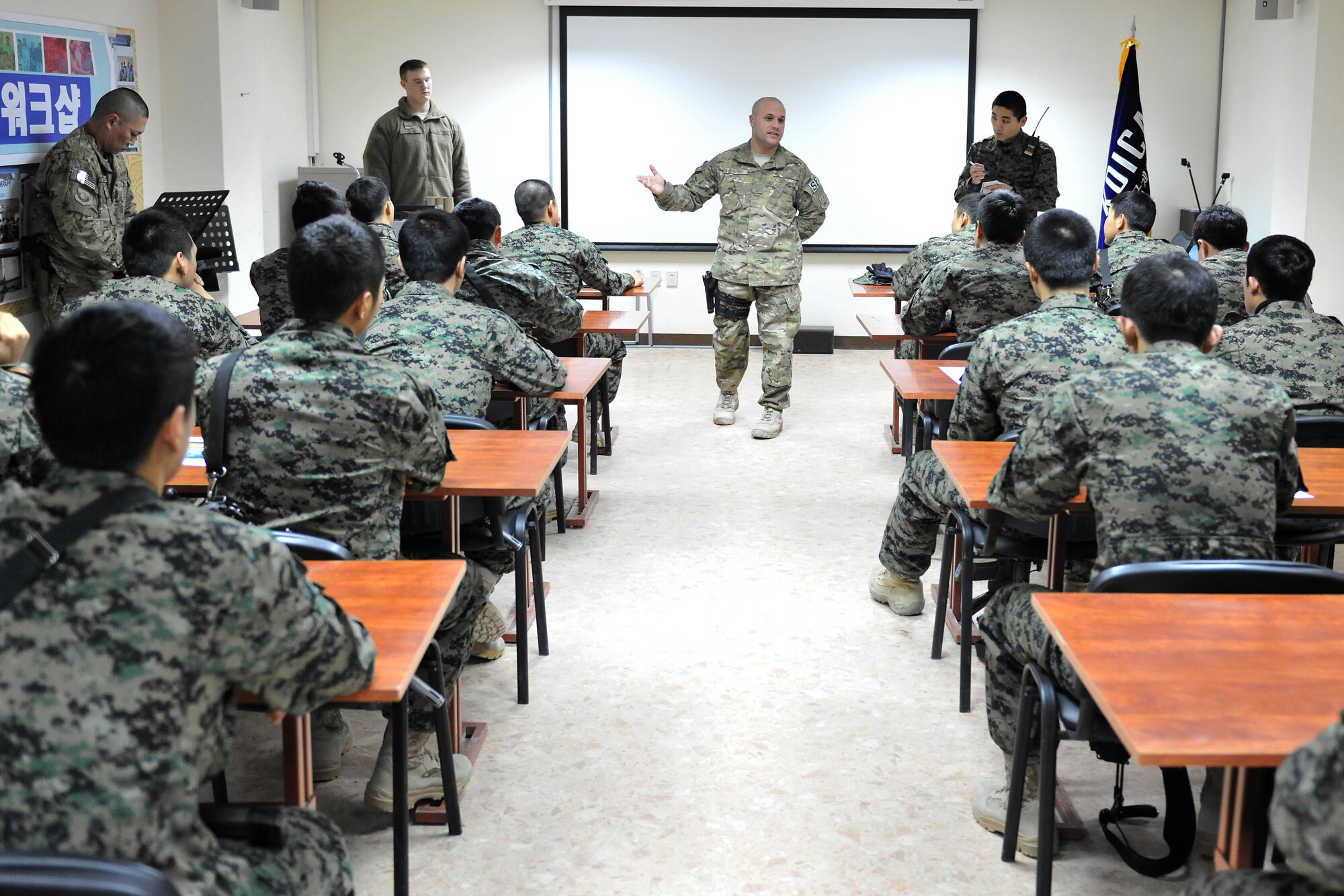Master Sgt. Thomas Carpino, 455th Expeditionary Security Forces Group bravo sector superintendent, instructs a classroom of Republic of Korea Army security forces at Bagram Airfield, Afghanistan, Jan. 16, 2013.  Members of the ROK security forces and 455th SFG work and train together to secure the airfield’s defense.  (U.S. Air Force photo/Senior Airman Chris Willis)