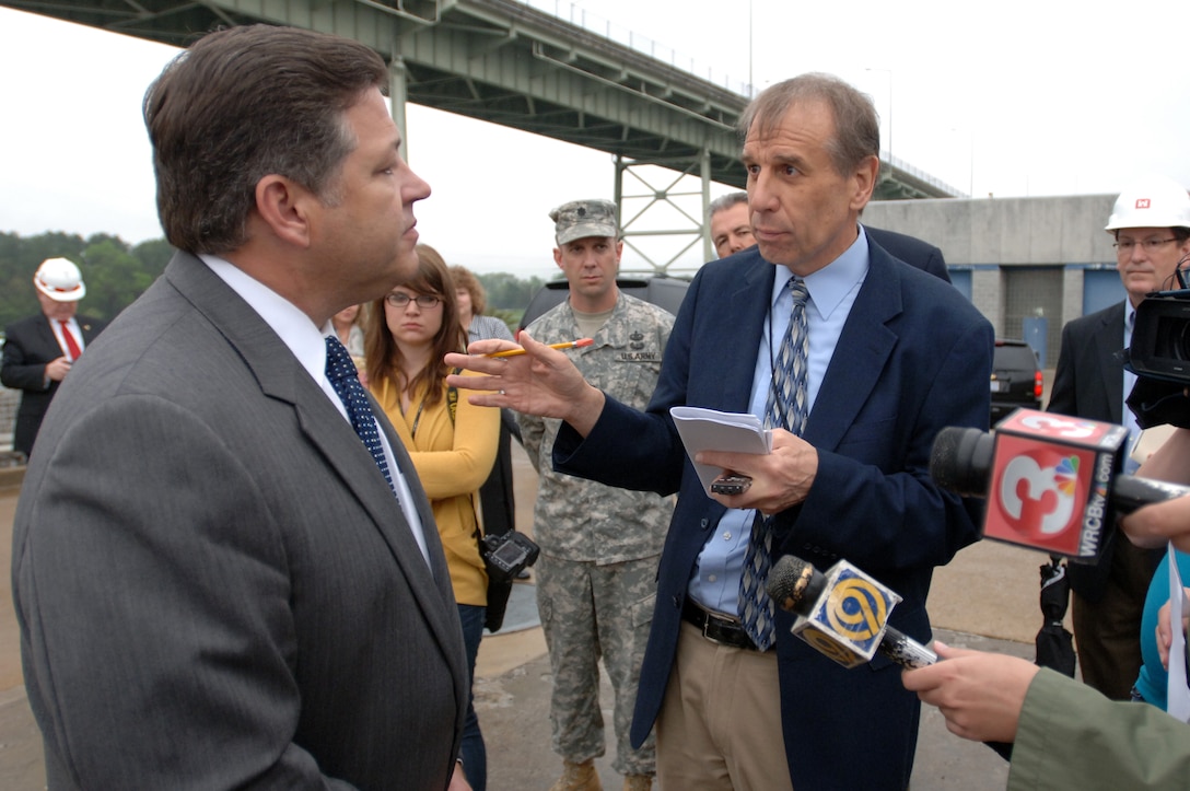 Congressman Bill Shuster, representative of the 9th District of Pennsylvania, responds to Chattanooga Times Free Press Reporter Dave Flessner during a tour of Chickamauga Lock in Chattanooga, Tenn., March 23, 2012.  Congressman Chuck Fleischmann (Not in photo), representative of the 3rd District of Tennessee, invited Shuster, chairman of the Subcommittee on Railroads, Pipelines and Hazardous Materials of the House and Infrastructure Committee, to tour the construction site of a new lock that is currently not appropriated for completion. Lt. Col. James A. DeLapp (Center), U.S. Army Corps of Engineers Nashville District commander, led the tour to explain the Lock Addition project to the Congressmen.
