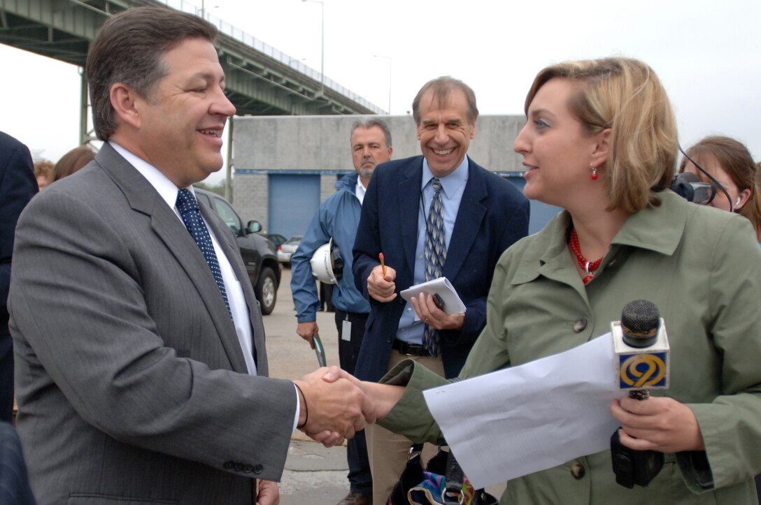 Congressman Bill Shuster, representative of the 9th District of Pennsylvania, speaks with News Channel 9 Reporter Natalie Jenereski during a media opportunity at Chickamauga Lock in Chattanooga, Tenn., March 23, 2012.  Shuster toured the Chickamauga Lock Addition Project at the request of Congressman Chuck Fleischmann (Not in photo), representative of the 3rd District of Tennessee. Shuster is the chairman of the Subcommittee on Railroads, Pipelines and Hazardous Materials of the House and Infrastructure Committee. The U.S. Army Corps of Engineers Nashville District has only partially completed the Lock Addition Project, which is currently not receiving any appropriations for its completion.