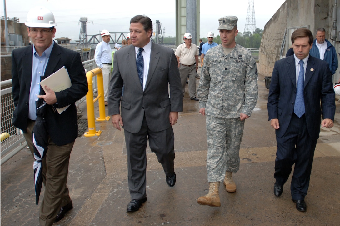 (Left to right) Mike Wilson, U.S. Army Corps of Engineers Nashville District deputy for Programs and Project Management; Congressman Bill Shuster, representative of the 9th District of Pennsylvania; Lt. Col. James A. DeLapp, Nashville District commander; and Congressman Chuck Fleischmann, representative of the 3rd District of Tennessee; tour Chickamauga Lock in Chattanooga, Tenn., March 23, 2012.  Nashville District officials provided technical details about the Lock Addition Project to the Congressmen.