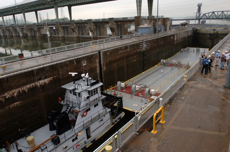 The Tug Boat Chariot K. Smith pushes a barge into Chickamauga Lock in Chattanooga, Tenn., March 23, 2012. From 1997 to 2010, annual tonnage passing through the lock ranged from .7 to 2.7 million tons.  The annual transportation rate of savings for one million tons of cargo going through this lock is estimated at $18 million. 