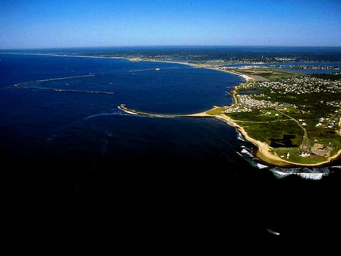 aerial view of Point Judith Pond and Harbor of Refuge, RI -- salt water body lying behind the barrier beaches and sand dunes that form Point Judith Harbor, which lies immediately west of Point Judith in Narragansett at the southwestern tip of Narragansett Bay.