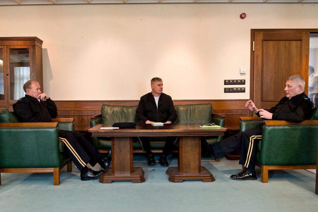 U.S. Army Gen. Martin E. Dempsey, left, chairman of the Joint Chiefs of Staff, U.S. Army Gen. David M. Rodriguez, center, and U.S. Army Gen. Carter F. Ham meet in Stuttgart, Germany, April 4, 2013. Dempsey traveled to Germany to meet with senior leaders and preside over a U.S. Africa Command ceremony during which Rodriguez succeeded Ham as commander.