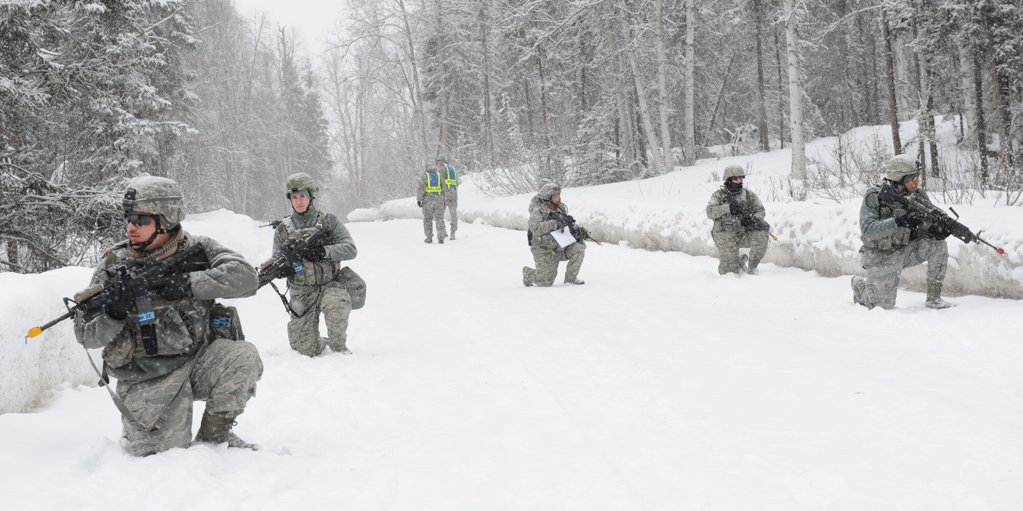 Security Forces Airmen perform tactical maneuvers on Camp Mad Bull, April 6, 2013.  Joint Base Elmendorf-Richardson Airmen are participating in exercise Polar Force 13-3 to increase readiness. (U.S. Air Force photo/Airman 1st Class Omari Bernard)