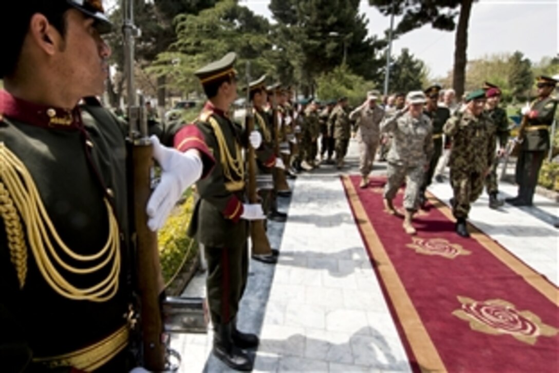 U.S. Army Gen. Martin E. Dempsey, chairman of the Joint Chiefs of Staff, and Afghan army Gen. Sher Mohammad Karimi arrive at the Ministry of Defense in Kabul, Afghanistan, April 6, 2013. 