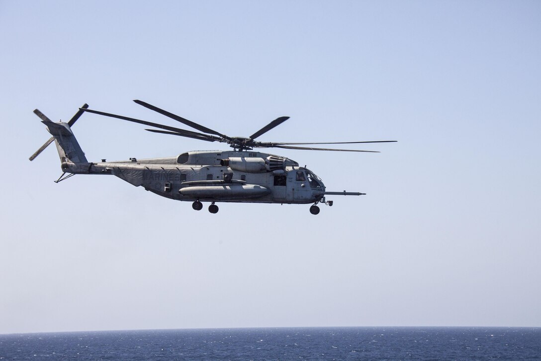 After delivering a resupply of ammunition, a CH-53E Super Stallion assigned to Marine Medium Tiltrotor Squadron (VMM) 266 (Reinforced), 26th Marine Expeditionary Unit (MEU), departs the USS Carter Hall (LSD 50) while at sea April 6, 2013. The MEU is currently deployed as part of the Kearsarge Amphibious Ready Group to the 5th Fleet area of operation. The MEU operates continuously across the globe, providing the president and unified combatant commanders with a forward-deployed, sea-based quick reaction force. The MEU is a Marine Air-Ground Task Force capable of conducting amphibious operations, crisis response, and limited contingency operations.
(U.S. Marine Corps photo by Staff Sgt. Edward Guevara/Released)