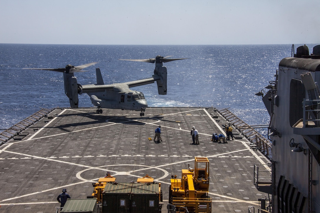 As part of an ammunition resupply, an MV-22B Osprey assigned to Marine Medium Tiltrotor Squadron (VMM) 266 (Reinforced), 26th Marine Expeditionary Unit (MEU), lands on the flight deck of the USS Carter Hall (LSD 50) while at sea April 6, 2013. The MEU is currently deployed as part of the Kearsarge Amphibious Ready Group to the 5th Fleet area of operation. The MEU operates continuously across the globe, providing the president and unified combatant commanders with a forward-deployed, sea-based quick reaction force. The MEU is a Marine Air-Ground Task Force capable of conducting amphibious operations, crisis response, and limited contingency operations.
(U.S. Marine Corps photo by Staff Sgt. Edward Guevara/Released)