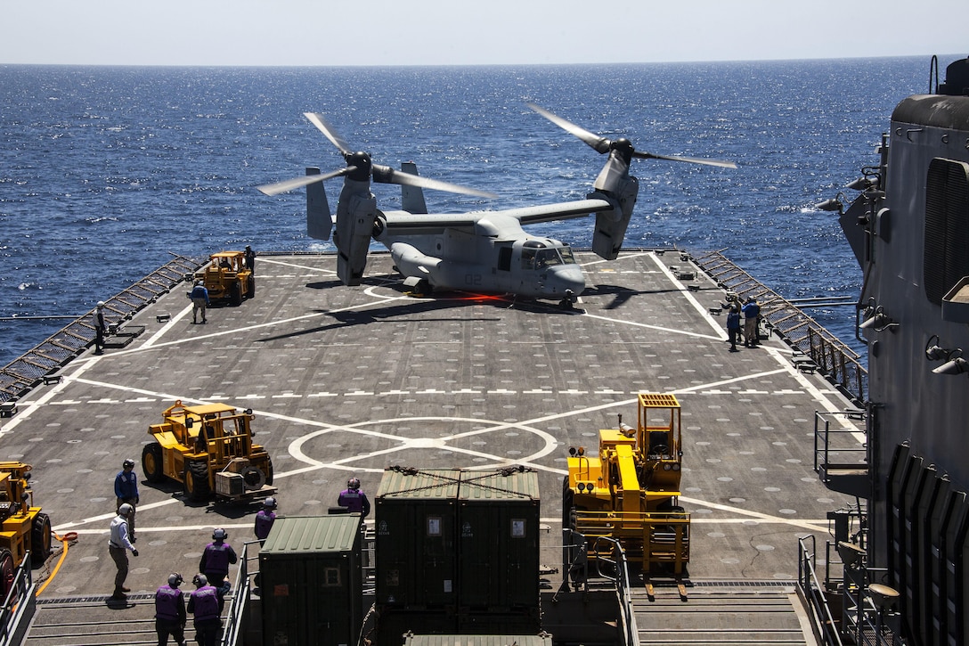 During a resupply of ammunition, an MV-22B Osprey assigned to Marine Medium Tiltrotor Squadron (VMM) 266 (Reinforced), 26th Marine Expeditionary Unit (MEU), sits on the flight deck of the USS Carter Hall (LSD 50) while at sea April 6, 2013. The MEU is currently deployed as part of the Kearsarge Amphibious Ready Group to the 5th Fleet area of operation. The MEU operates continuously across the globe, providing the president and unified combatant commanders with a forward-deployed, sea-based quick reaction force. The MEU is a Marine Air-Ground Task Force capable of conducting amphibious operations, crisis response, and limited contingency operations.
(U.S. Marine Corps photo by Staff Sgt. Edward Guevara/Released)