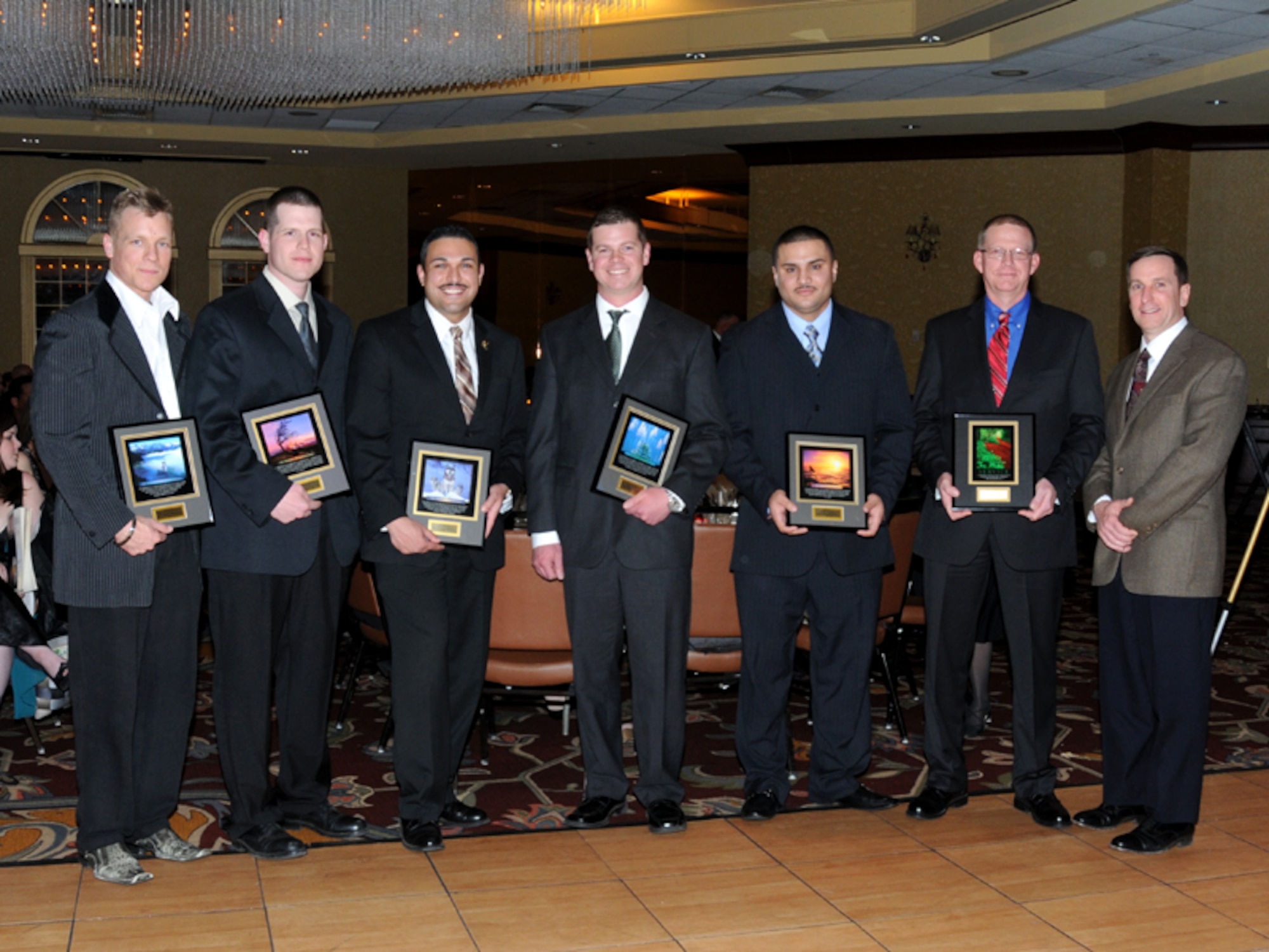 Six members of the 104th Fighter Wing, Barnes Air National Guard Base, Westfield Mass. receive Wing Awards. From left, Capt. Osme Benedict, Tech. Sgt. Jeremiah McClosky, Master Sgt. Yasser Menwer, Tech. Sgt. Michael Kearns, Staff Sgt. Charles Diaz, Master Sgt. Larry Brace and Col. James Keefe at the 39th annual awards banquet. The 104th Fighter Wing held their annual awards banquet at the Sheraton Hotel, Springfield Mass., April 6, 2013. (Air National Guard photo by TSgt. Melanie J. Casineau)