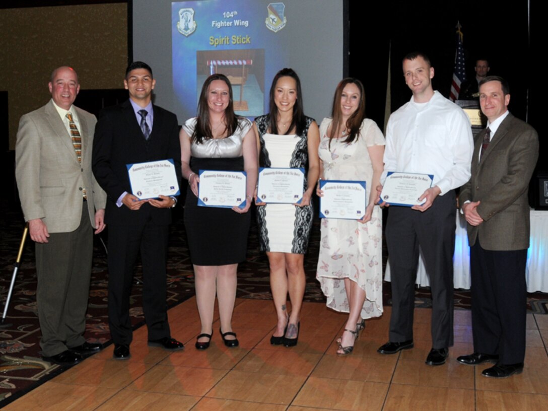Four members were presented their Community College of the Air Force degrees April 6, 2013. From left, Command Chief Master Sgt. Todd Fappiano, Staff Sgt. Miguel Gonzalez, Tech. Sgt. Christine Lupacchino, Tech. Sgt Sandra Pulliam, Tech. Sgt Heather Cekovsky, Tech. Sgt Nathaniel Donnachie and Col. James Keefe at the 39th annual awards banquet. The CCAF provides two-year educational programs to enlisted members of the active duty Air Force, Air National Guard, and Air Reserve Command. (Air National Guard photo by Tech. Sgt. Melanie J. Casineau)