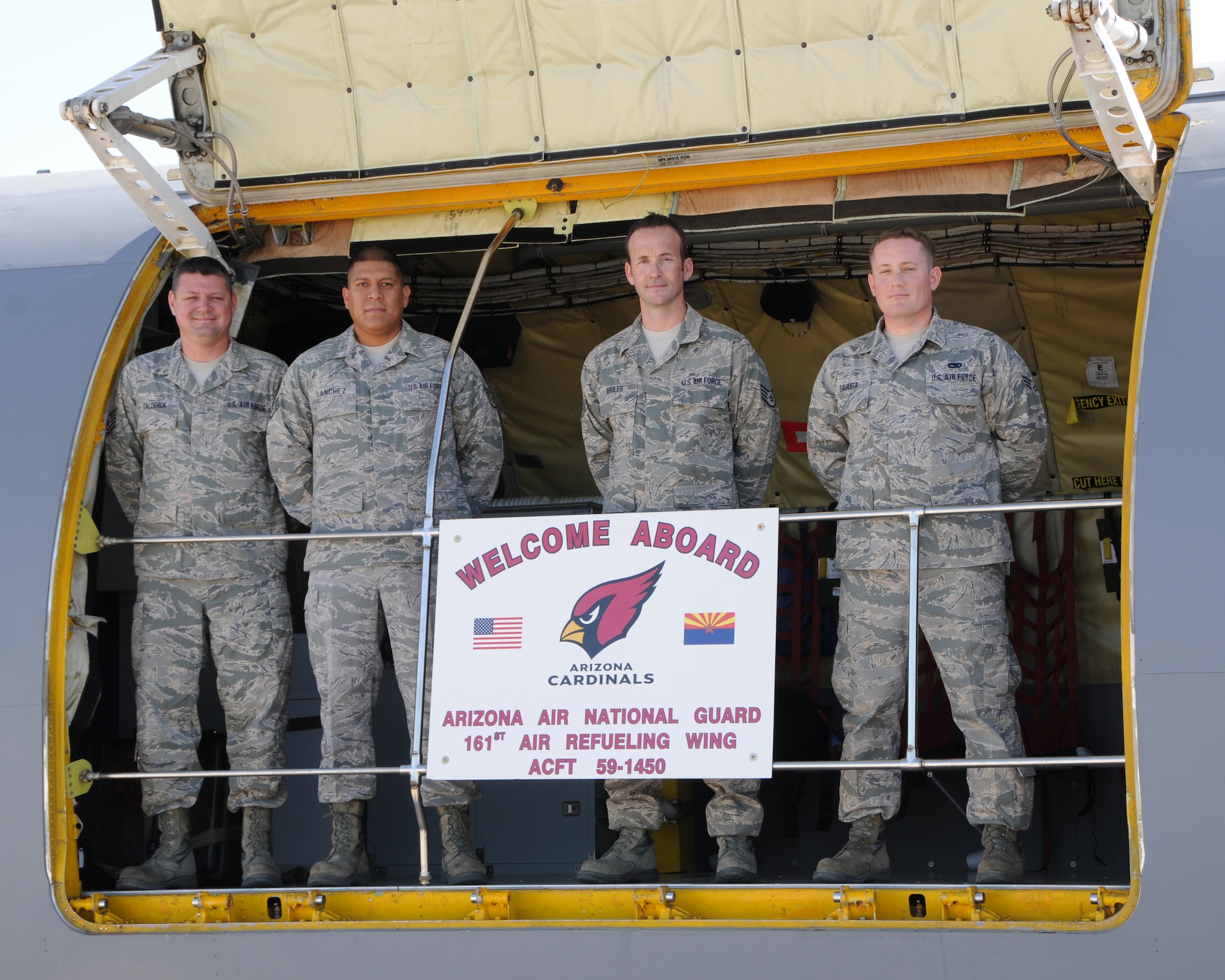 Tech. Sgt. Erik Calderon, Staff Sgt. Patrick Sanchez, Senior Airman Josh Briles and Senior Airman Nick Savasta, 161st Maintenance Group crew chiefs, win the unit's award for Outstanding Aircraft of the Second Quarter with a Mission Capability Rating of 94.09 percent at the 161st Air Refueling Wing, Phoenix, April 7, 2013. Assigned to aircraft #59-1450 “Red Bird”, these Airmen maintained their jet throughout 28 sorties and 100.6 flying hours over the past three months and beat out eight other crews in competition for this award being judged on a combination of expertise and flawless inspections. (Air National Guard Photo by Staff Sgt. Courtney Enos/Released)